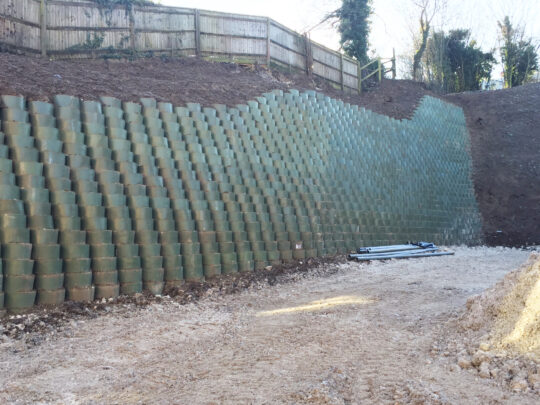 Webwall system reaching up to 8.25m tall at the far corner of the site