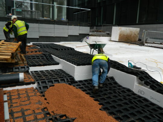 Fitting Roofdrain 60 to the base of the new podium deck landscaped area