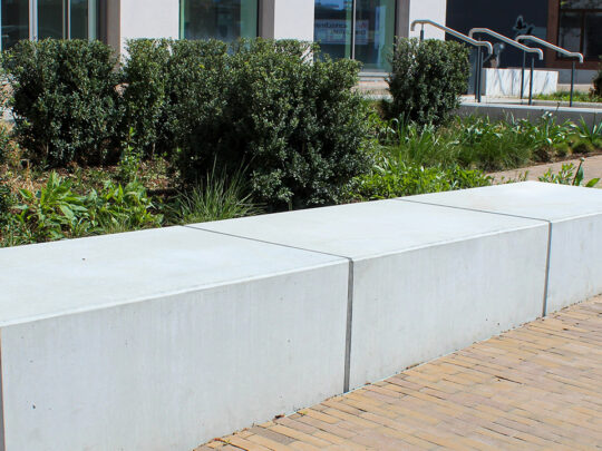 Completed area of podium deck landscaping with paving and planter finishes