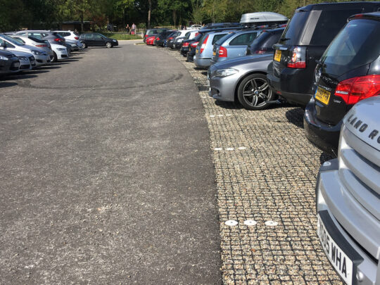 Gravel retained in the plastic paving cells provides free-draining parking bays
