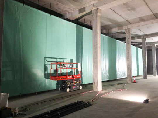 Inside the newly constructed reservoir with concrete pillars supporting the chamber roof.