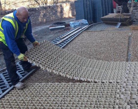 Sudspave units were pre-formed into panels for rapid installation and easily interlocked before surface gravel was brushed into the surface. Truckcell provides a robust, permeable and lightweight surface, easily installed via the paver's locating lugs
