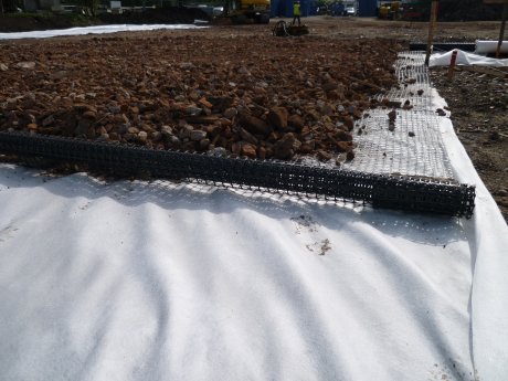 Terrex geotextile and Abgrid geogrid supporting 6F2 hardcore over soft ground
